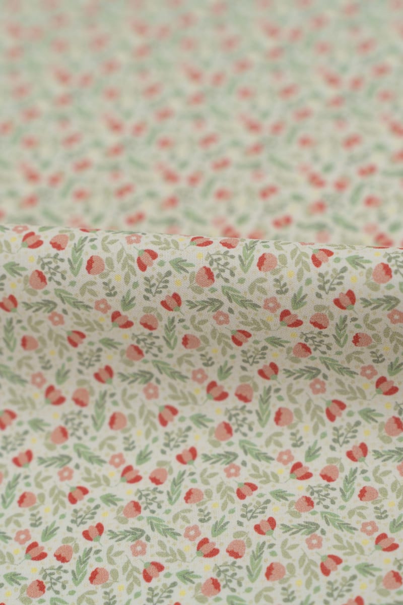 Tejido infantil con estampado de flores.
